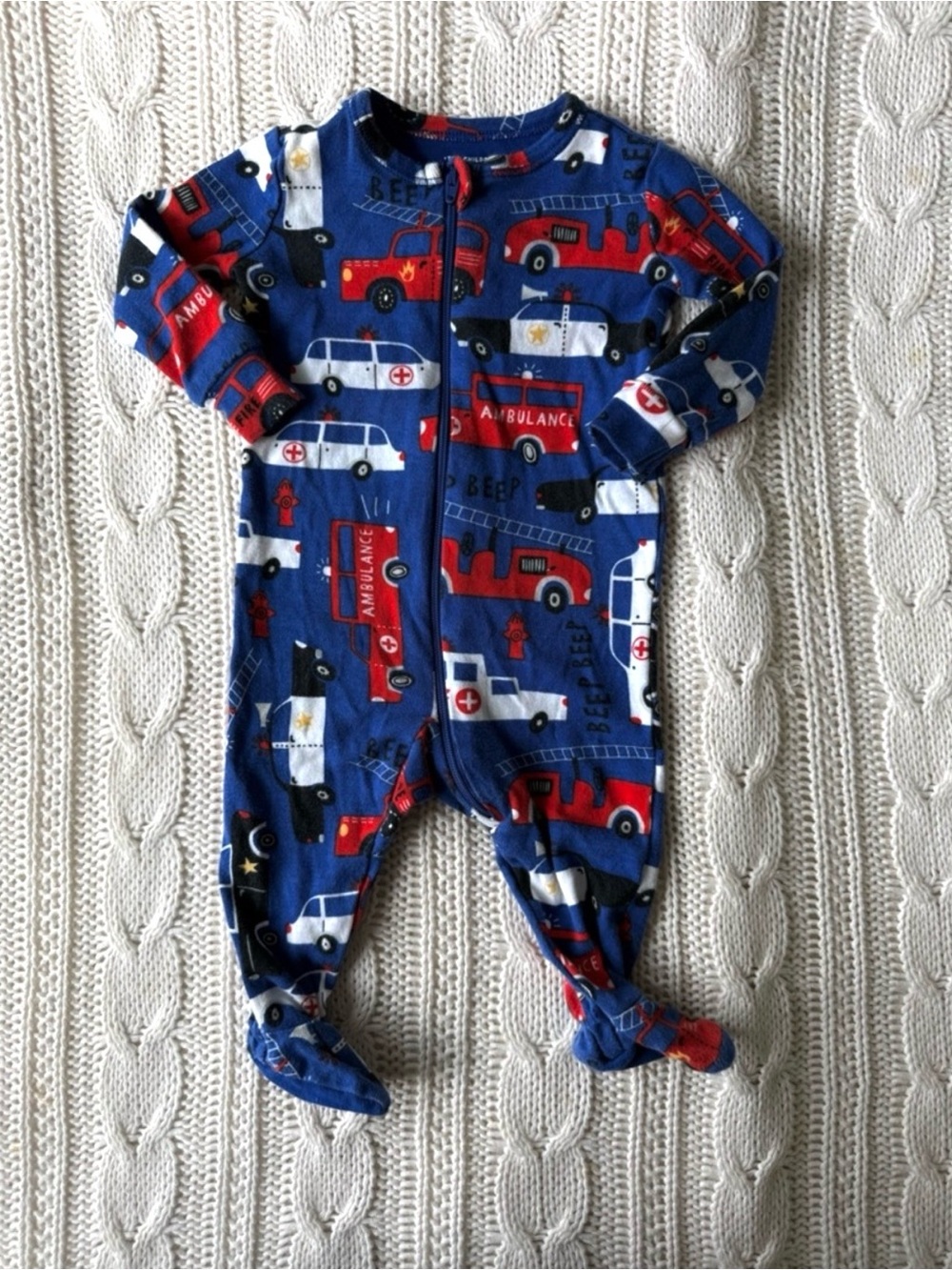 Children’s Place Blue Emergency Vehicle Print Footed One-Piece for Kids 0-3M